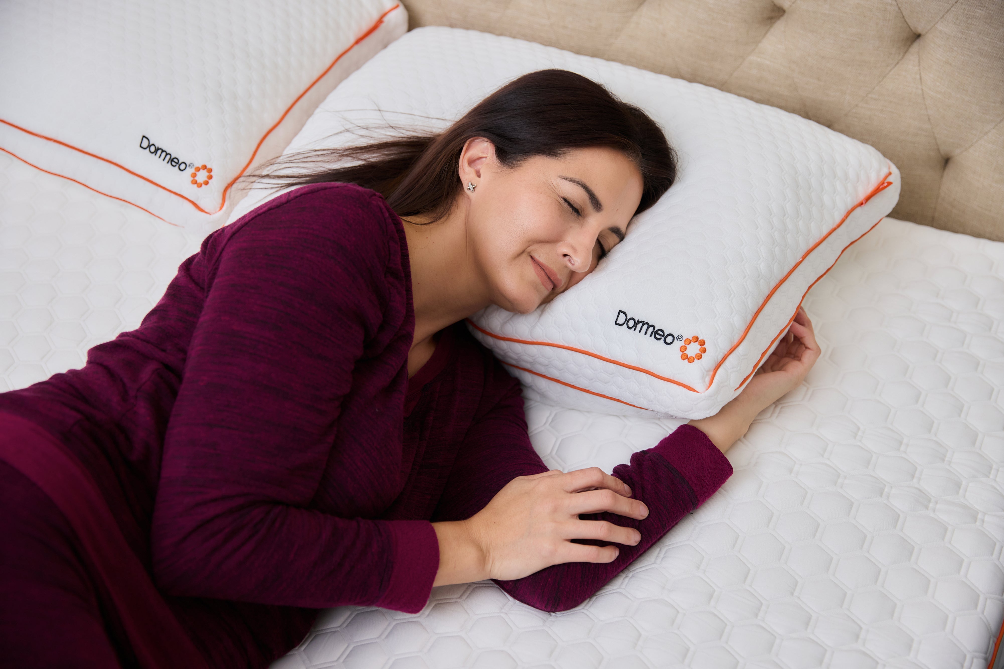 woman happily sleeping on a topper
